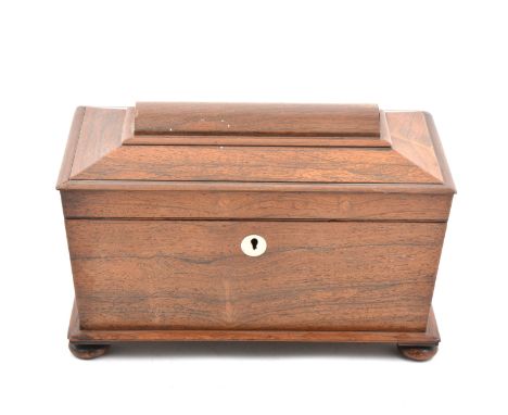 Victorian rosewood tea caddy, sarcophagus shape with bun feet, fitted interior, 36cm.