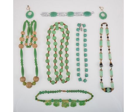 Pressed glass and bakelite jewellery simulating jade, an 80mm rope of 12.5mm dragon beads, knotted with amber coloured spacer