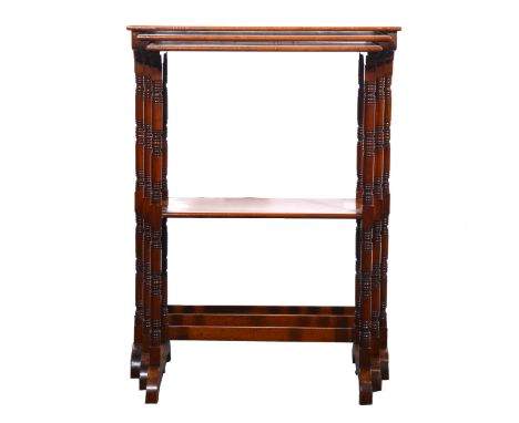 Victorian nest of three occasional tables, rectangular tops, turned and ringed legs, the smallest joined by a shelf, 54cm and