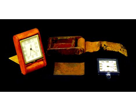 A vintage LeCoutre travel clock, with eight day movement, Arabic dial with luminous hands, gilt metal case 7 by 5.5 by 1.8cm,