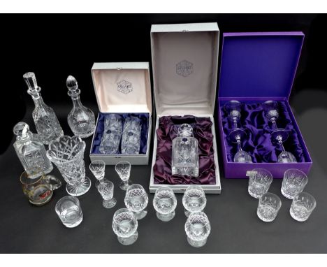 A collection of glass crystal wares boxed Stuart Crystal decanter, boxed Edinburgh Crystal decanter, Waterford decanter, squa