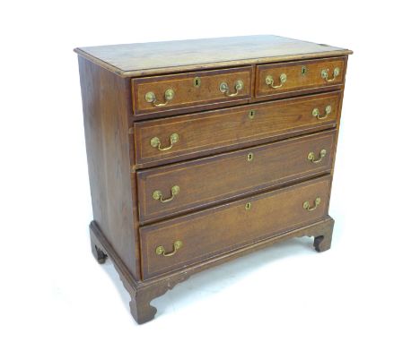 A Georgian oak chest of two short over three long drawers, with brass swan neck handles, raised upon bracket feet, 92.5 by 50