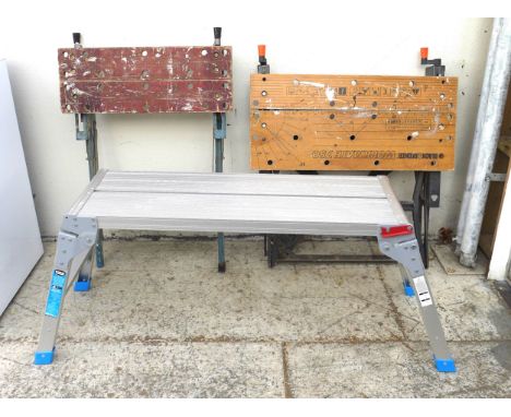 A MacAllister aluminium work bench/step along with two Black and Decker workbenches, and two step ladders.