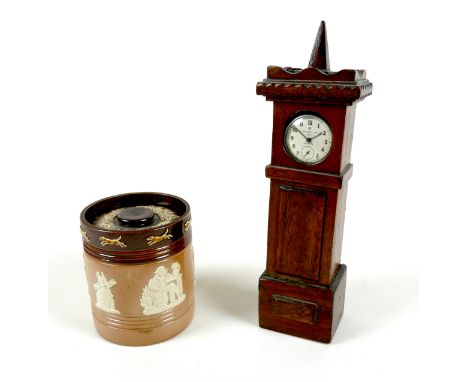 An Edwardian Royal Doulton harvest ware tobacco jar, applied moulded white decoration depicting various figures sitting at ta