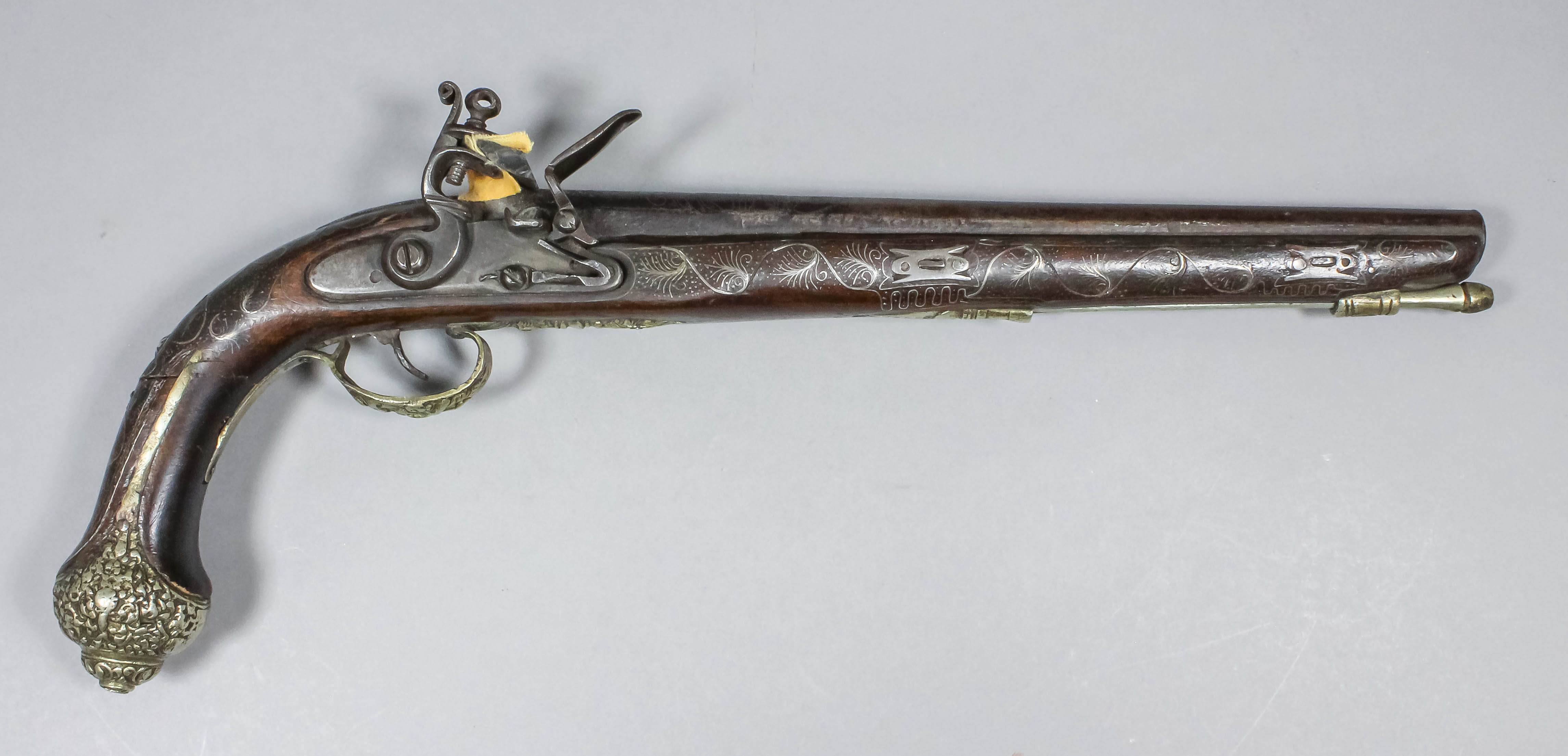 An 18th Century Caucasian flintlock pistol, the 13ins Damascus steel ...