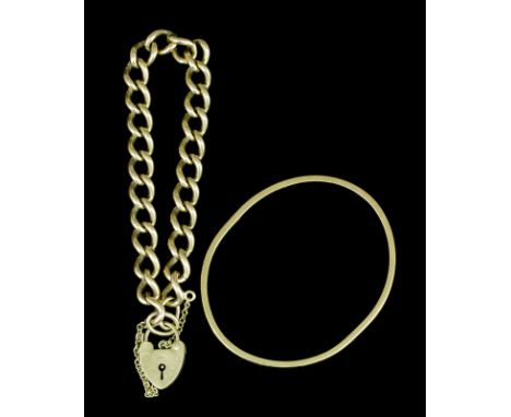 A modern 9ct gold stiff bangle (gross weight 18 grammes) and a 9ct gold curb link bracelet with heart pattern padlock, 190mm 