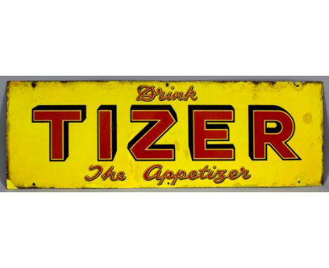 A 20th Century enamel advertising sign - "Drink Tizer The Appetizer" -  in red letters on a yellow ground, 12ins x 36ins over