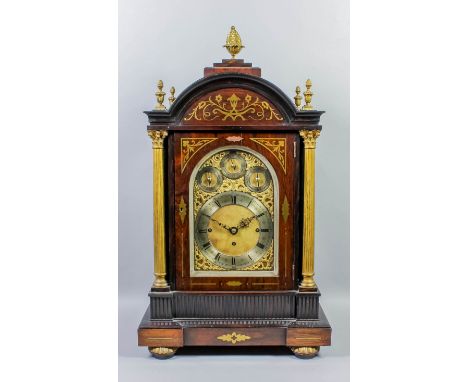 A late 19th Century rosewood and brass inlaid cased mantel clock, the arched brass dial with 6.75ins diameter silvered chapte