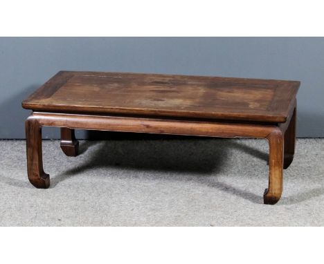 A Chinese rosewood rectangular "Opium" table with plain flush panel top, on shaped supports, 30ins wide x 16ins deep x 11ins 