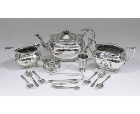 A late Victorian silver three piece rectangular tea service, the shaped rims with scroll mounts and with panelled bodies, she