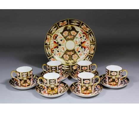 Six Royal Crown Derby bone china coffee cans and saucers painted and gilded with an "Imari" design (majority with date codes 