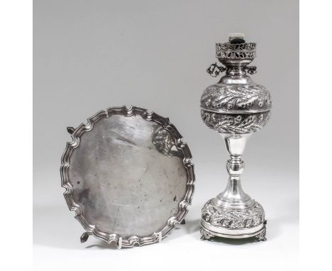 A George V silver circular salver with shaped and moulded rim on four scroll and pad feet, 8.125ins diameter, by Edward Barna