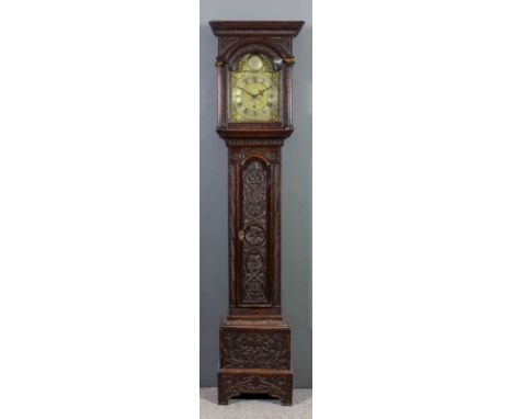 An 18th Century oak longcase clock by John Rigg of Gisbrough (Guisborough, North Yorkshire), the 11ins square brass dial with