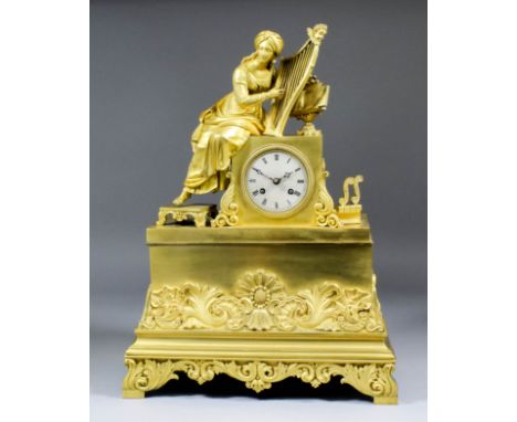 An early 19th Century ormolu cased mantel clock by S. Marti & Cie, No. 1776 48, the 3ins diameter silvered dial with Roman nu