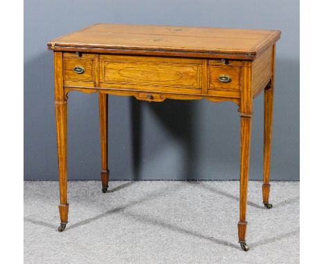 An Edwardian satinwood rectangular card/games table, the whole inlaid with bandings and stringings, the baize lined folding t