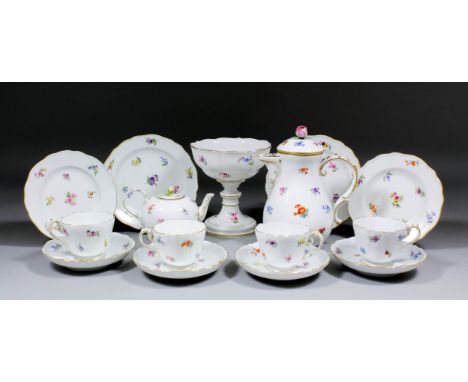 A 20th Century Meissen porcelain Harlequin tea and coffee service enamelled in colours with scattered Deutsche Blumen designs
