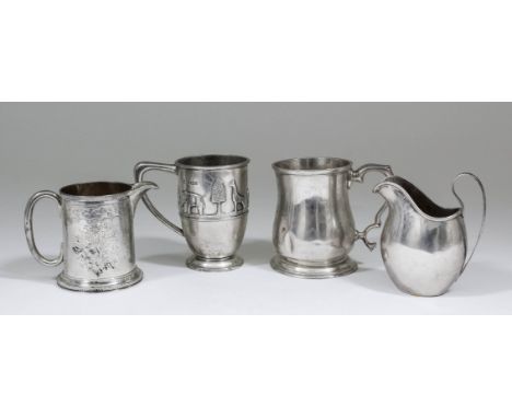 A George V silver cylindrical christening mug embossed with a band of figures and animals, 3.875ins high, by William Hutton &