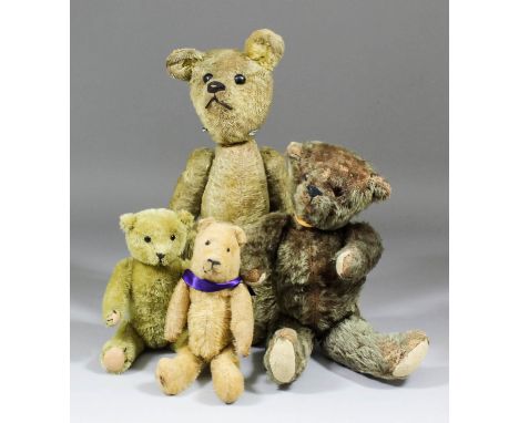 An American mohair teddy bear with button eyes and hump, 14ins high, an early mohair bear with purple bow, 8.5ins high, a bro