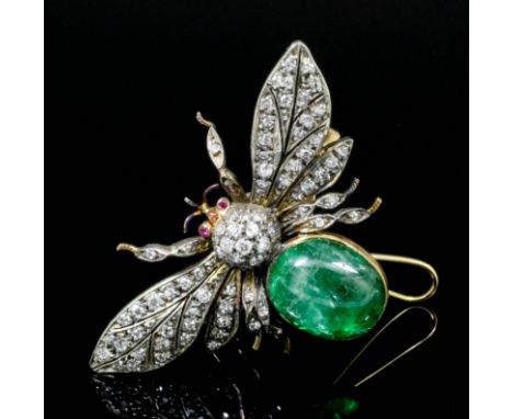 A late Victorian gold coloured metal mounted diamond, emerald and ruby bee pattern brooch, the wings and head set with sixty-