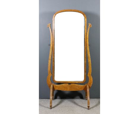An early 20th Century birdseye maple framed rectangular cheval mirror inset with bevelled mirror panel and on shaped uprights
