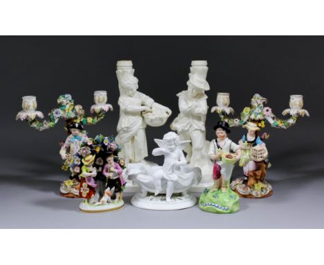 A pair of late 19th Century Copeland pottery white glazed candlestick figures modelled as "Autumn" and "Winter", each 11.5ins