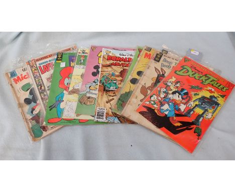 A COLLECTION OF CHILDRENS COMICS including 'Duck Tales' first issue , Woody Woodpecker, Looney Tunes and other cartoon charac