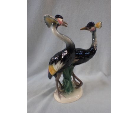 A WEST GERMAN CERAMIC MODEL OF TWO EXOTIC BIRDS brightly coloured