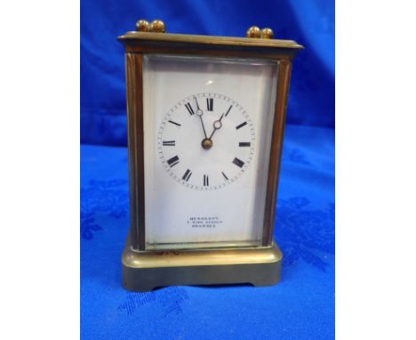 A BRASS-CASED CARRIAGE CLOCK BY HENNESSY OF SWANSEA the striking movement by Japy Freres, 13cm high