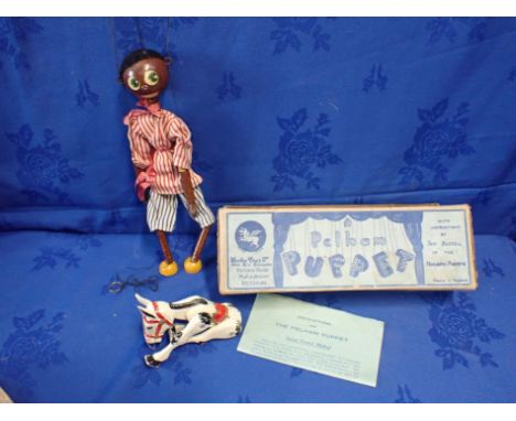 A PELHAM PUPPET BLACK CHARACTER, IN BLUE LABELLED BOX and a diecast metal 'Muffin the Mule' puppet (both playworn)