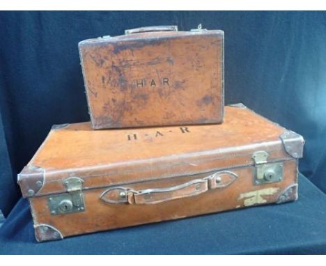 A VINTAGE LEATHER SUTCASE 67 cm WIDE, AND ANOTHER SMALLER (larger needs handle repair)