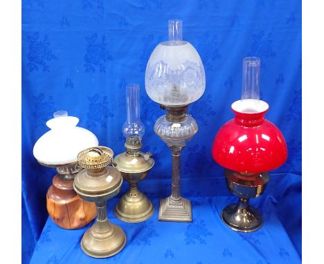 A VICTORIAN SILVER-PLATED COLUMN OIL LAMP with etched globe, and Hinks burner (electrified), and four other oil lamps