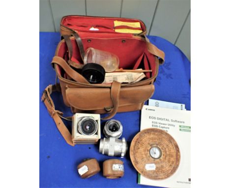TWO WOODEN NAPKIN RINGS FROM HMS AJAX AND HMS ANSON toether with a photographic bag and lenses and another wooden item