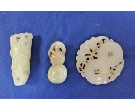 A JADE NETSUKE IN THE FORM OF A PEACH together with a jade carving and a pendant