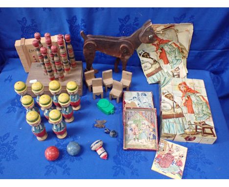 TWO SETS OF VINTAGE WOODEN SKITTLES an articulated wooden toy dog, picture bricks and other items