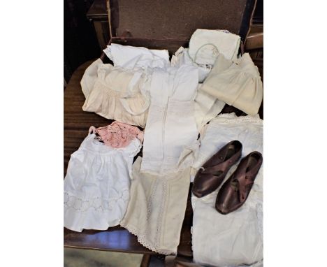 A VINTAGE PAIR OF CHILD'S WOODEN SOLED CLOGS and a collection of chilldren's clothing, including nightdresses, bonnets, etc, 