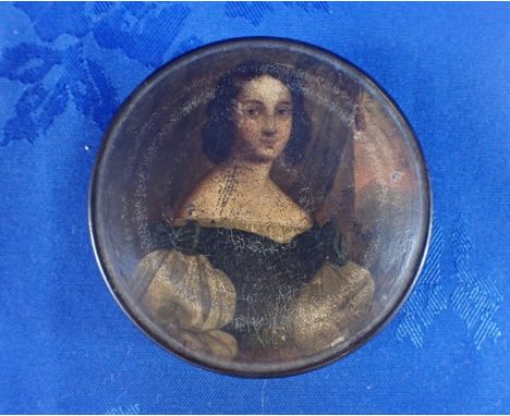 A 19TH CENTURY PAPIER MACHE SNUFF BOX painted with a portrait of a woman 9cm diam