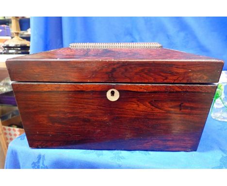 A ROSEWOOD TEA CADDY with an inlaid shell escutcheon, 17cm high x 30cm wide