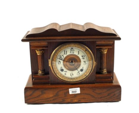 An Oak cased striking mantel clock
