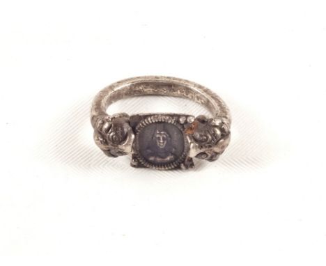 A Hellenistic Bactrian Silver lion head ring, 2nd Century BC