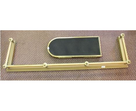 A Brass rail fender and a mesh fireguard