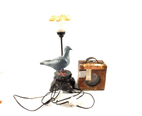 A pigeon clock and spelter pigeon table lamp