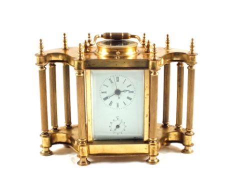An unusual gilt metal carriage clock with ten external fluted pillars and alarm movement