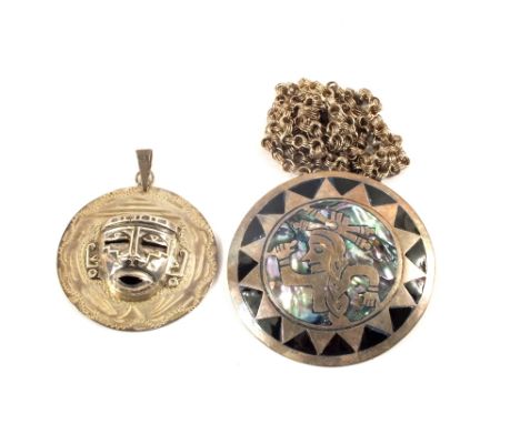 Two Mexican Silver pendants, one with enamel and Mother of Pearl decoration