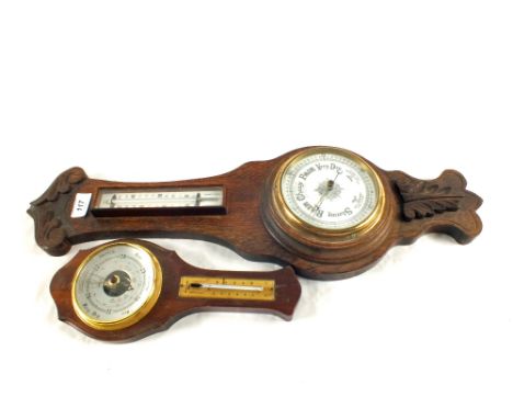 A carved Oak barometer plus one other
