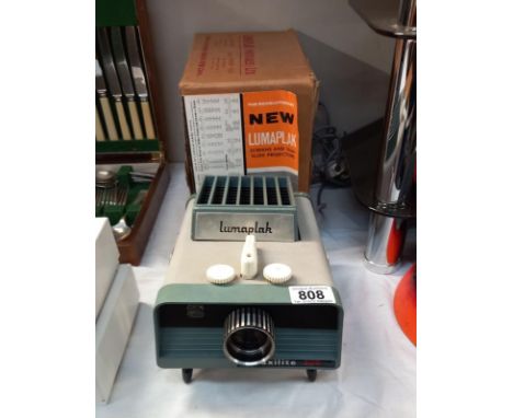 A boxed vintage Lumaplak 35mm slide projector