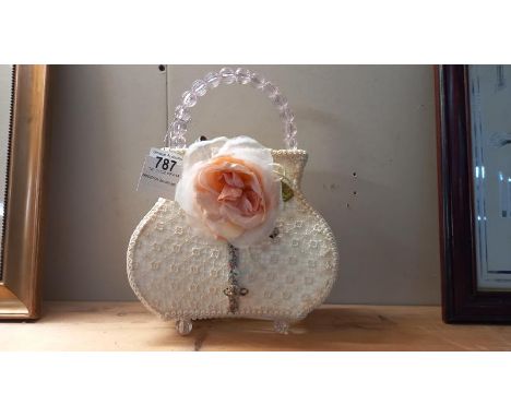 A decorative lamp styled as a ladies handbag IWO