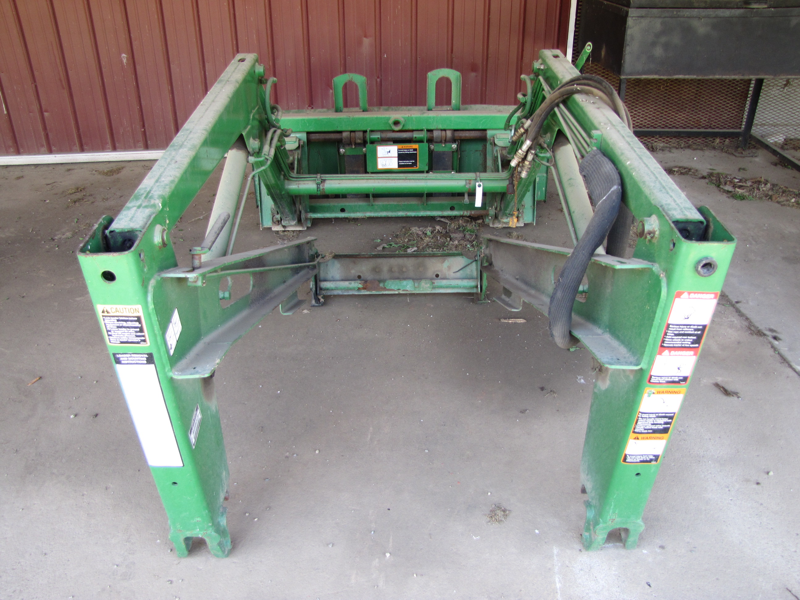 John Deere 460 Loader Attachment, includes 5’ bucket and pallet forks