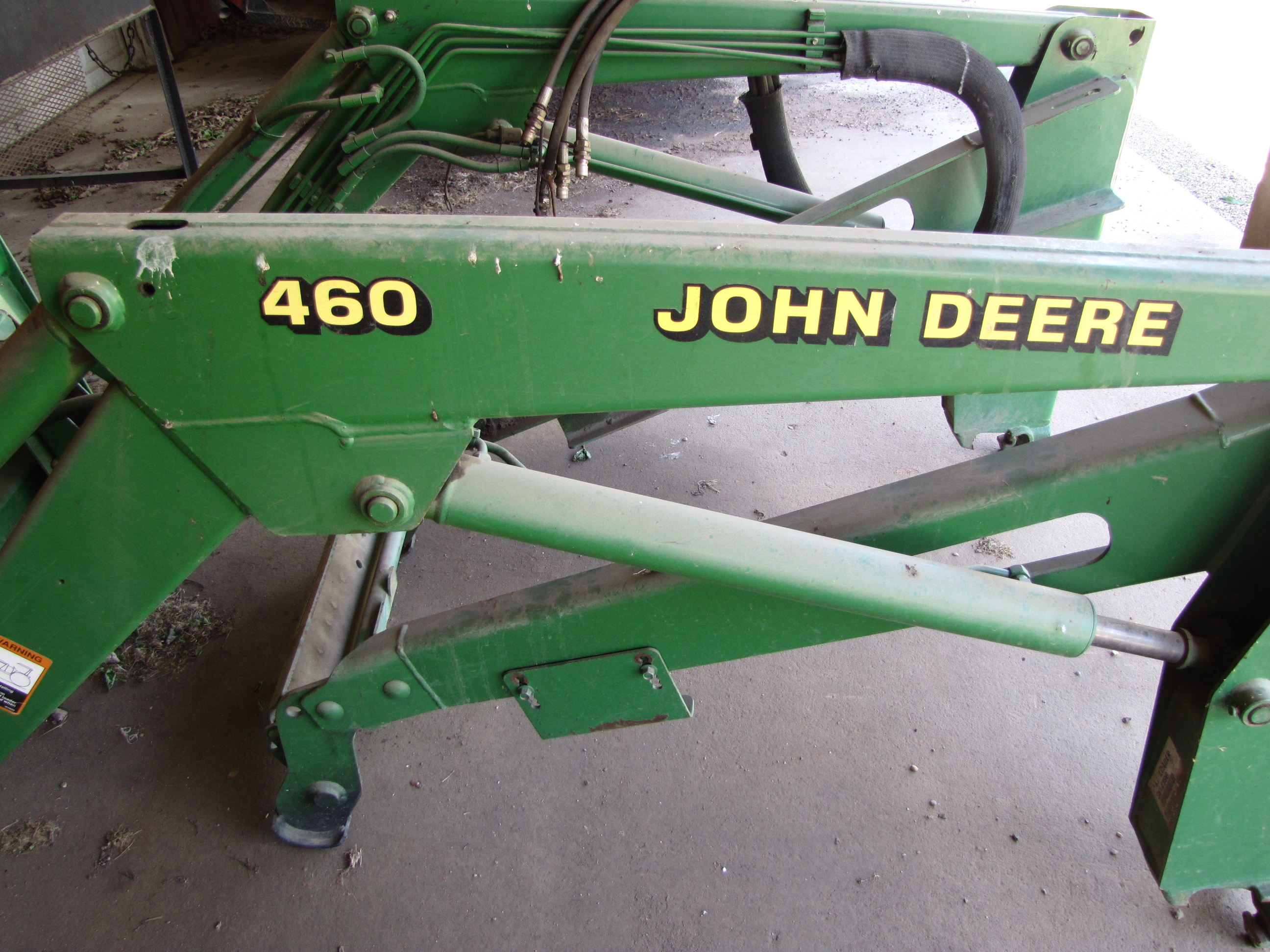 John Deere 460 Loader Attachment, includes 5’ bucket and pallet forks