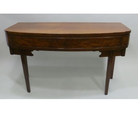 A REGENCY DESIGN BOW FRONTED MAHOGANY SIDE OR SERVING TABLE having single drawer raised on squared tapering supports, 141cm w