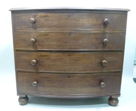 AN EARLY 19TH CENTURY MAHOGANY BOW FRONTED CHEST having knop handles, four drawers and later turned feet, 105cm x 115cm 